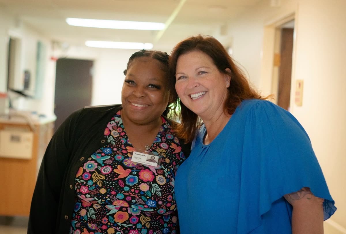 Two members of the Silver Oak therapy and care team smiling together